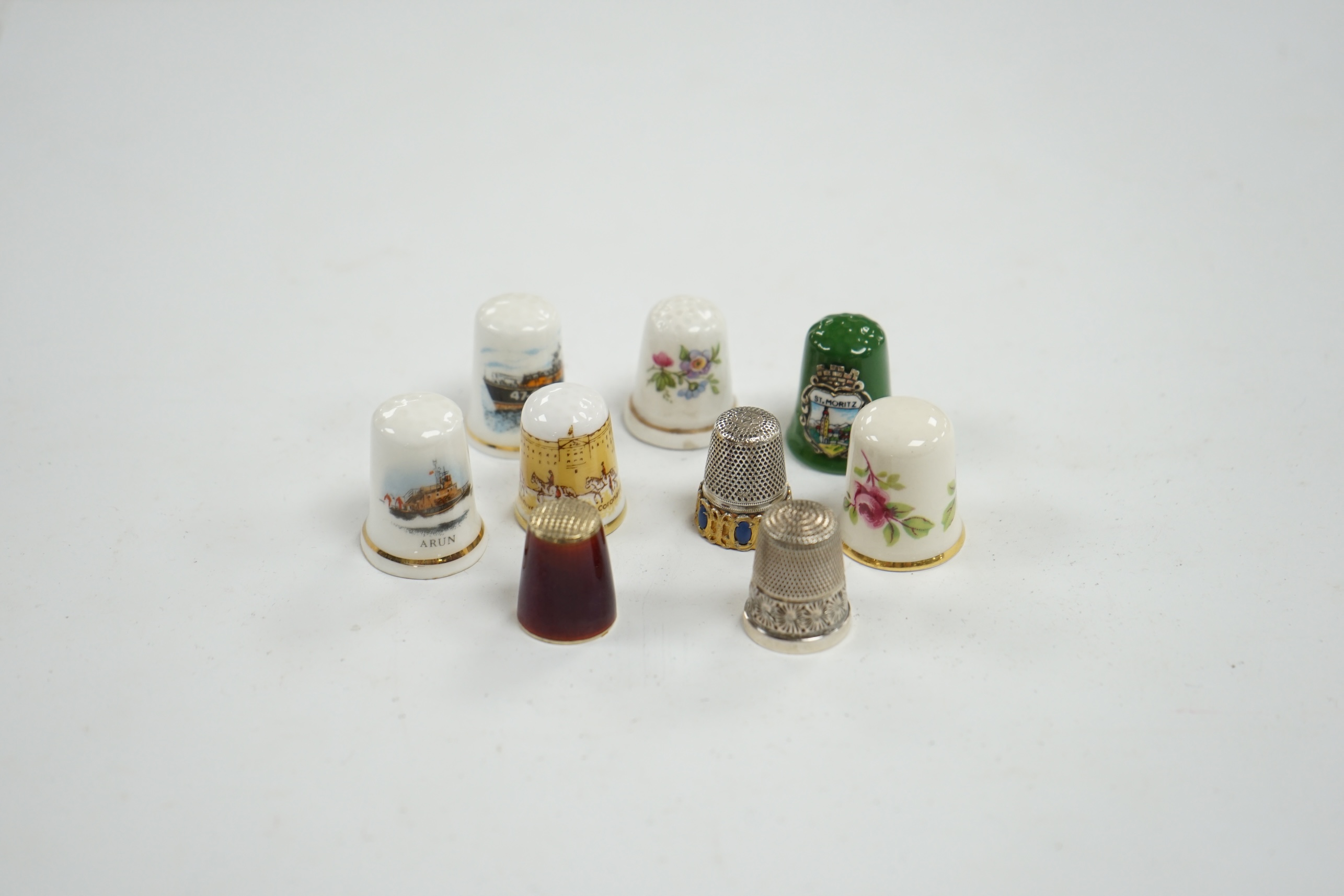 A large collection of silver, nickel, brass and ceramic thimbles, and two thimble display perspex domes. Condition - fair